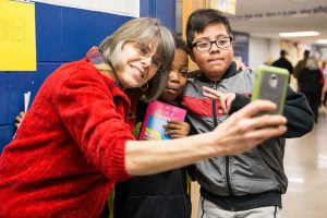 Mary Beth Tinker takes a selfie with students during a stop at Harding Middle School.