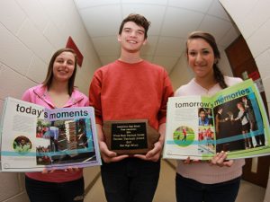 Becca Novak, PJ Graham and Sarahi Trejo pose with East's award-winning yearbook. (Photo by East student Brian Chang)