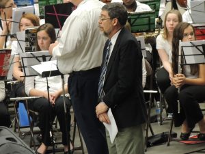 Jim Goodwin, Weeks Middle School band director, prepares to conduct the All-City Music Festival finale.  Goodwin also wrote the piece.