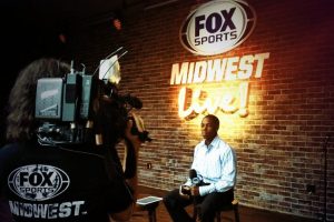 Lester Mwirichia waits to conduct an interview at Ball Park Village with Fox Sports Midwest and the St. Louis Cardinals.  Lester was in the KDPS studios this week talking about how to “set yourself apart” during a high profile internship.