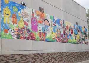 The Oak Park Elementary School 8'x48' mural overlooks the playground on the west side of the building.