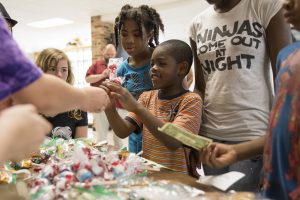 Summer programs provide a diverse mix of experiences, including a bake sale fundraiser for Meals from the Heartland.