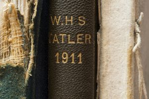 The spines of the 1909-11 editions of the Tatler, the yearbooks for West High (forerunner of Roosevelt High School).