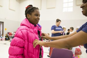 Athene continues the company's long tradition of providing winter coats and boots to students at McKinley Elementary School.