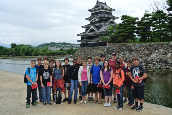 Students pose for photo in Japan.
