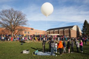 Students in the Science Bound program at Callanan Middle School launch Cougar IV, a weather balloon experiment conducted by students.