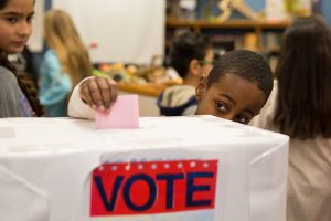 While 5th graders at River Woods Elementary School took part in a mock caucus, every student to cast a ballot in the school's straw poll.