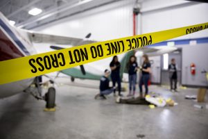 The district's new aviation technology facility was the crime scene for the Central Campus criminal justice class.