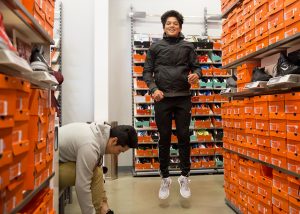 A North High student checks out the new spring in his step at the Nike Outlet.