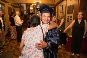 A well-deserved hug for one of the newest alumni of Scavo High School.