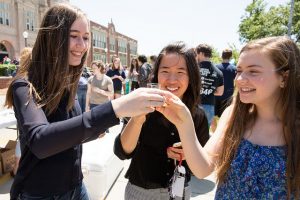 Students toast their release of their new concoction at the unveiling of Rider Root Beer.