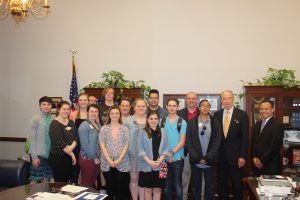 Central Campus culinary arts students and teachers meet with U.S. Senator Chuck before accepting their Excellence in Action award.