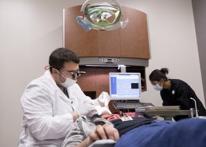 Dentist examining a patient.