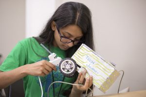A student works on a robotics project at Tech Camp.