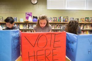 Students vote in mock election.