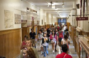 Students in a crowded school hallway.
