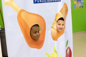 Students pose for picture dressed as food.