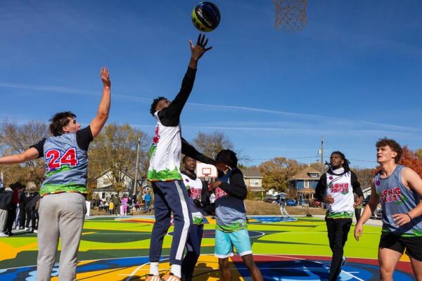 Students playing in basketball tournament 