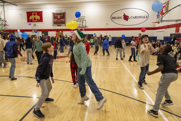 students and teachers playing in the gym