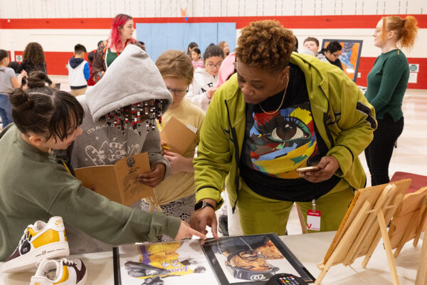 artist showing student her work